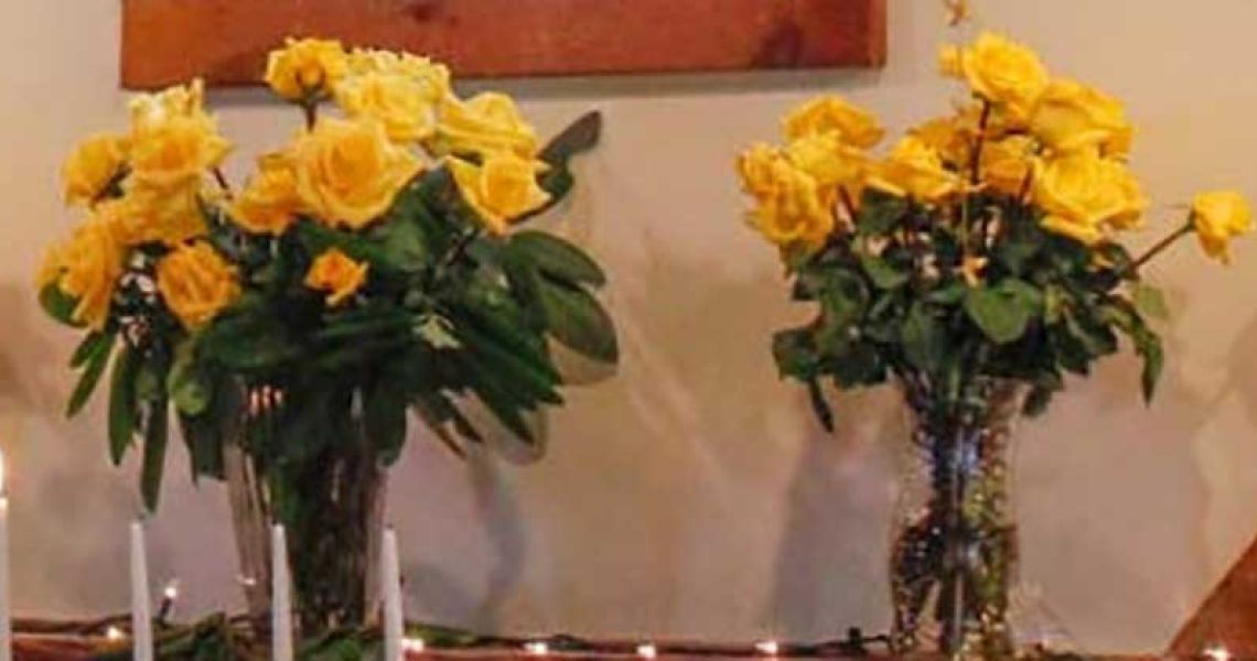 Yellow roses in vases