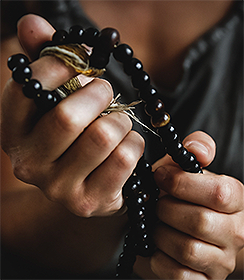 Woman holding spiritual beads